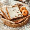 imageDECRAFTS Round Rattan Tray Woven Bread Basket with Handles Small Cracker Tray for Serving Dinner Parties Coffee Table Tea Natural 11 inches Diameter11 inch