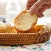 imageDECRAFTS Round Rattan Tray Woven Bread Basket with Handles Small Cracker Tray for Serving Dinner Parties Coffee Table Tea Natural 11 inches Diameter11 inch